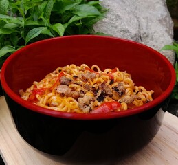 a bowl of delicious spicy fried noodles