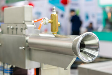 close up inlet gate of automatic high speed sausage peeler machine for peel off sausage inedible plastic or cellulose casing for food industrial
