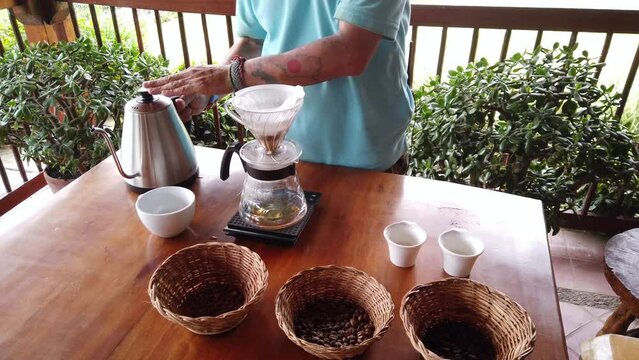 preparation of the coffee drink following the Colombian tradition, American coffee - Coffee plantation in Salento area cafetera in Colombia - filter and hot water 