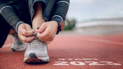 The starting point  running on a treadmill 2023 symbolizes the beginning of a new year.concept...