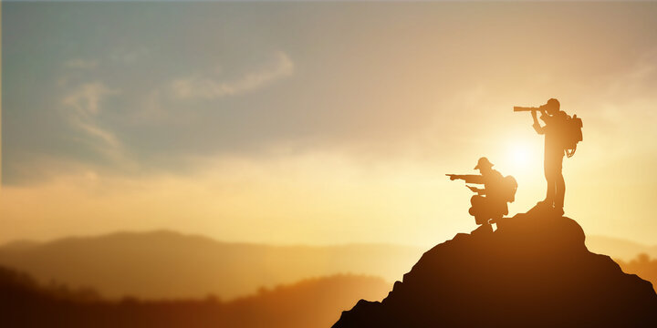 vision for success ideas. businessman's perspective for future planning. Silhouette of two men hold binoculars and open map on mountain peak against bright sunlight sky background.