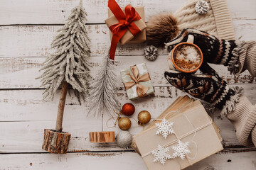 Vintage books, Christmas gifts and decorations on white wooden background