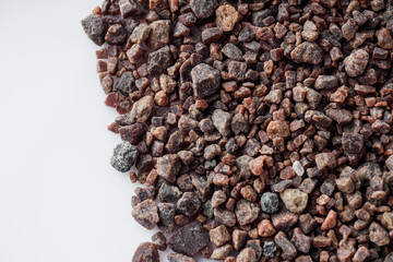 crystalline black Himalayan salt on a white background