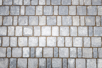 stone pavement top view on the texture of the stones. rectangular shapes of stones