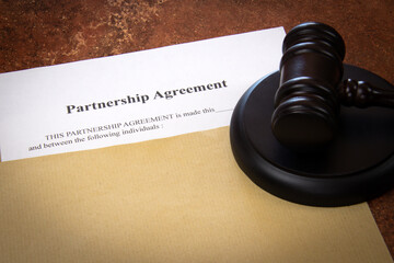 partnership agreement document in envelope on a table