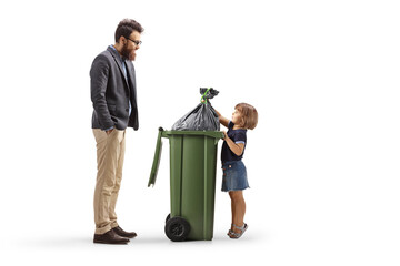 Man watching a little girl throwing a waste bag in a bin