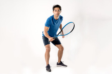 Male tennis player playing tennis with striving for victory gesture.