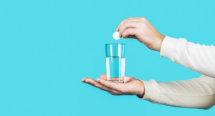 Glass of water tablet. Glass with efervescent tablet in water with bubbles. White pill and a glass...