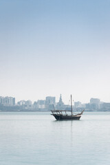 Traditional dhow boat docked in corniche, Doha, Qatar.