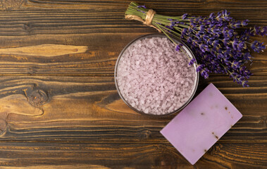 Lavender flowers, fragrant sea salt and handmade soap. The concept of spa, beauty and health salon, skin care cosmetics. Natural cosmetics.Aroma procedures. Close up photo on white wooden background.