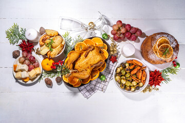 Christmas or New Year dinner foods on white wooden table. Set of traditional Xmas party dishes -...