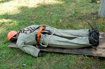 An electrician's mannequin for teaching the rescue of a victim of a high voltage shock.