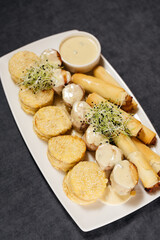 Meat medallions and cannelloni with cheese sauce. Restaurant concept.