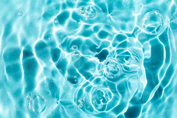 Textured background of rippled water with bubbles