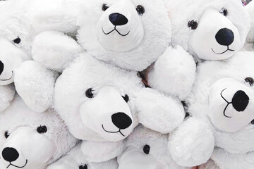 Fuzzy and fluffy cozy soft toy white polar bears closeup, full-frame background