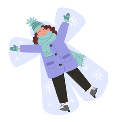 Young woman making a snow angel in the snow