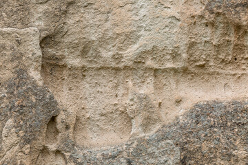 The surface of the gray-beige sandy rock. Background. Space for text.