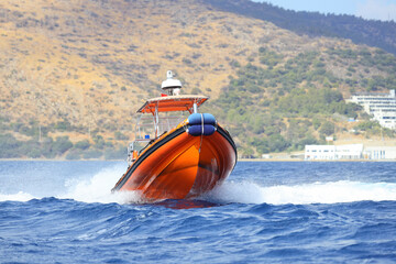 The coast guard boat conducts inspection in the Aegean Sea.