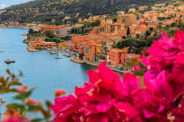 Villefranche sur Mer medieval town in South of France with bougainvillea blossom