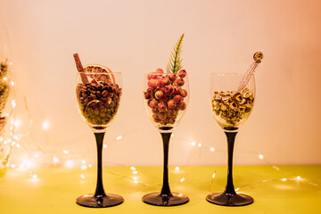 Composition of glasses, candles and decorative elements. New Year's mood