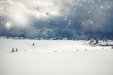 Fototapeta na wymiar Wooden houses under snow