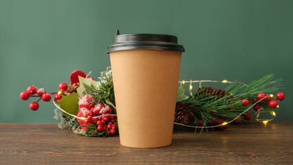 Cup of coffee to go, red berries and Christmas tree branches - Christmas holiday background