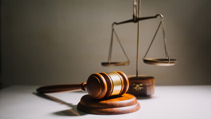 Business and lawyers discussing contract papers with brass scale on desk in office. Law, legal...
