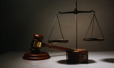 Business and lawyers discussing contract papers with brass scale on desk in office. Law, legal...