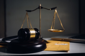 Business and lawyers discussing contract papers with brass scale on desk in office. Law, legal...