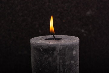 
candle on a black background