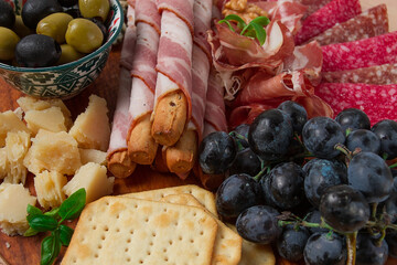 Appetizer, assortment, set, sausage, and cheese, on a wooden board, top view, no people,