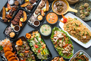 Assorted south indian food, Mutton Brain Masala, Chicken Tangdi, Chicken Reshmi tikka, Chicken karahi, Beef Nehari , Beef Bihari kabab, Beef tikka Boti, Garlic Naan aand lachha paratha isolated