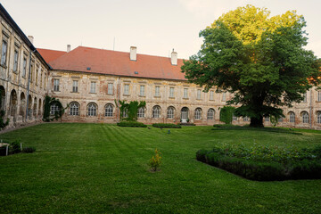 Courtyard with peacocks of Benedictine monastery in Rajhrad., Czech Republic.