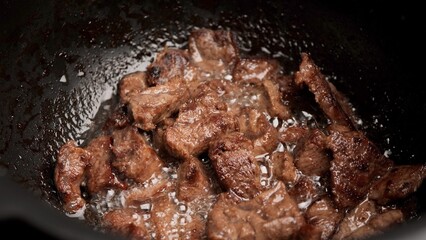 Cooking meat in multicooker, close up