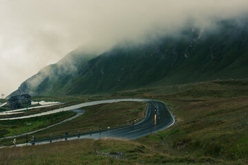 alpine mountain road with motocycle - obrazy, fototapety, plakaty