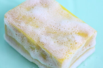 Bar of solid soap foamy yellow soap