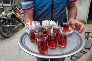 Close Up Shot of Man Holding Tea Tray