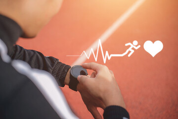 Women measuring heart rate with a watch after running