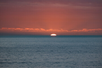 Beautiful horizon sunrise sunset dusk dawn twilight blue hour over ocean sea with sea gulls nature seascape scenery