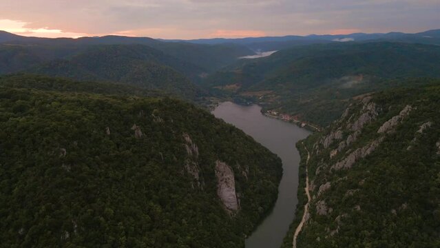 Drone video of the Danube gorge on Romanian side with the statue of king Decebalus in the view. Video was shot at a higher altitude  in the summer at sunset. 