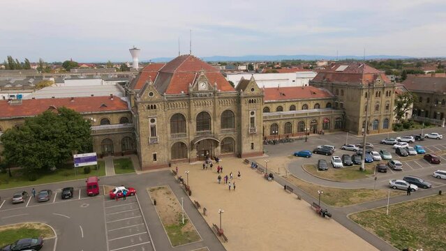 Aerial view of the train station in Arad city, Romania. Footage was shot from a drone at a lower altitude while flying in a circular way around the main building.