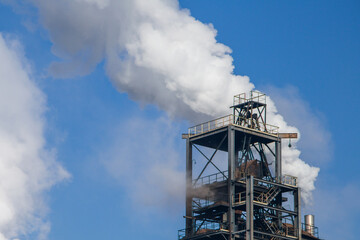 the concept of environmental pollution. white thick smoke pollutes the environment.