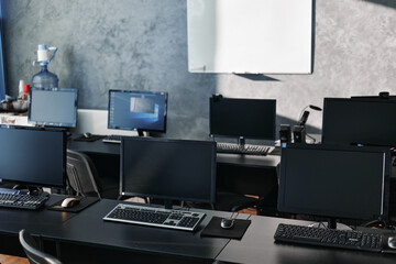 Office room equipped with computers for working on project