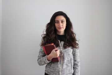 Stylishly dressed young caucasian woman. young caucasian woman with black long wavy hair