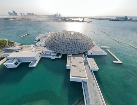 Abu Dhabi, UAE - November 8, 2021: Aerial view of the Louvre museum at the golden hour