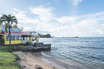 Rocky beach in Dominica, Roseau. Caribbean coastal city with access to the sea
