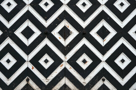 background of black and white diamonds and squares.