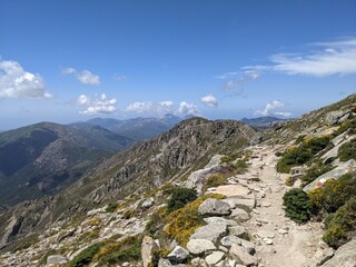 GR20 high mountain path with beautiful mountain views in the backround in Corsica, France, Europe