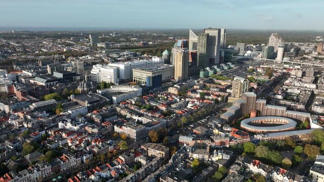 Den Haag Holland Spoort train station, Rode Dorp, China town, Stationsbuurt, Rivierenbuurt and skyline of the Hague in The Netherlands, south Holland. Aerial drone view.