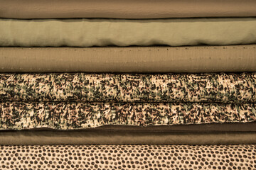 Rolled silk fabric in various shades closeup